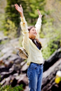 Girl raising hands in praise